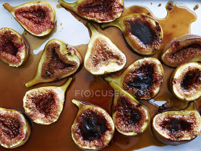 Roasted figs on surface, overhead view — Stock Photo