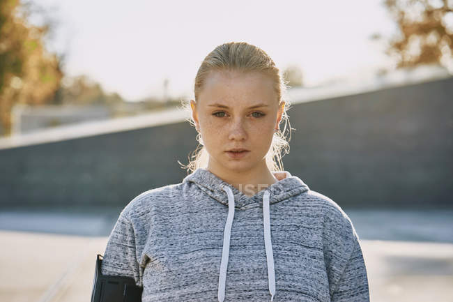 Backlit portrait of young woman training — Stock Photo