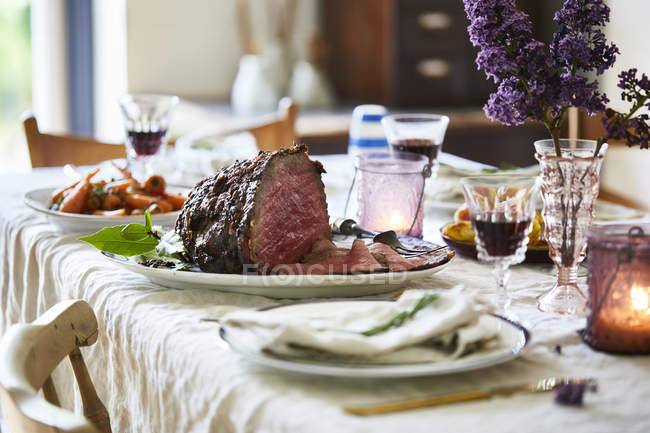 Sunday roast on dining table, ready to serve — Stock Photo