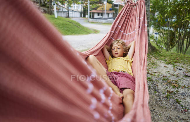 Boy lying in hammock, Tavares, Rio Grande do Sul, Brazil, South America — Stock Photo