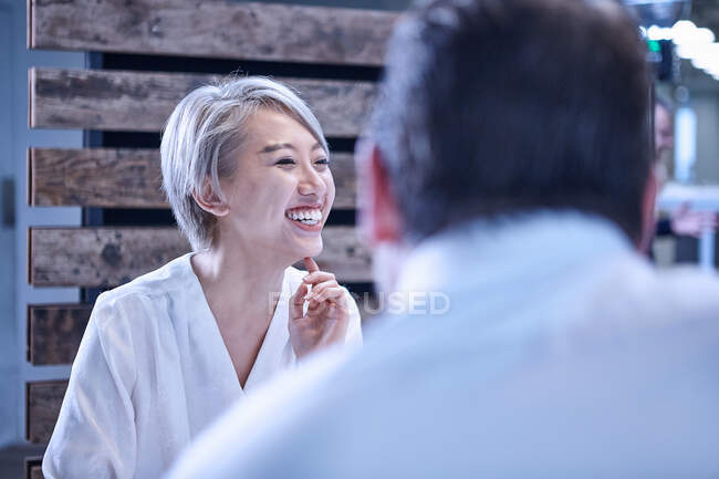 Woman looking away laughing — Stock Photo