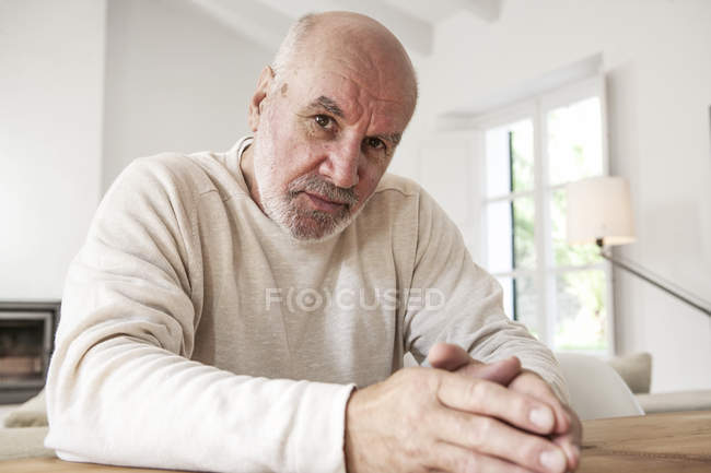 Portrait of senior man, pensive expression — Stock Photo