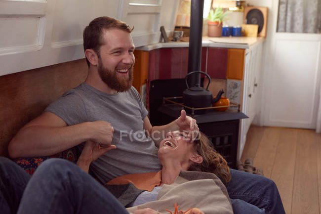 Couple reading together at home — Stock Photo