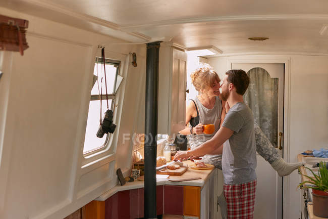 Couple having breakfast in canal boat — Stock Photo