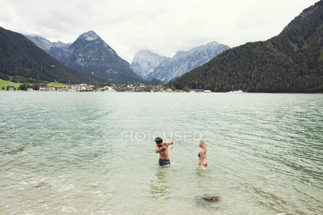 Couple waist deep in water, Achensee, Innsbruck, Tirol, Austria, Europe — Stock Photo