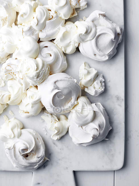 Freshly baked meringues, overhead view — Stock Photo