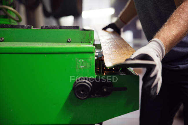Man in workshop, making ski equipment, mid section, close-up — Stock Photo