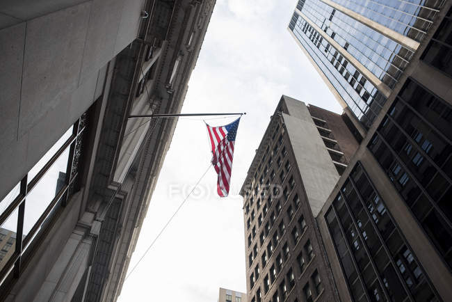 American flag, skyscrapers, New York, USA — Stock Photo