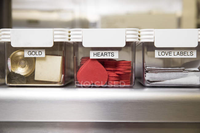 Cake decorations in labelled containers — Stock Photo