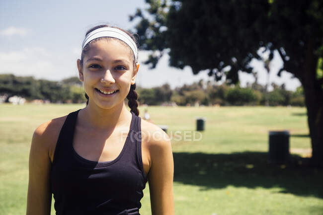 Portrait of schoolgirl on school sports field — Stock Photo