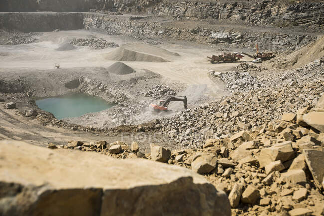 Quarry with heavy machinery in use — Stock Photo