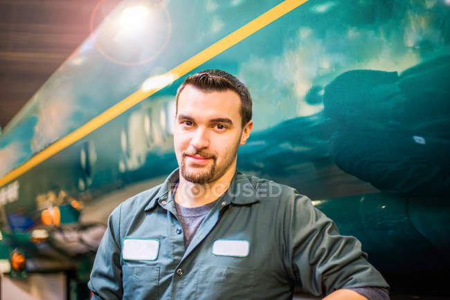 Portrait of young male trucker at bio fuel industrial plant — Stock Photo