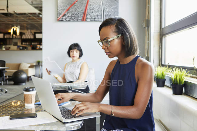 Two colleagues working together in modern office — Stock Photo