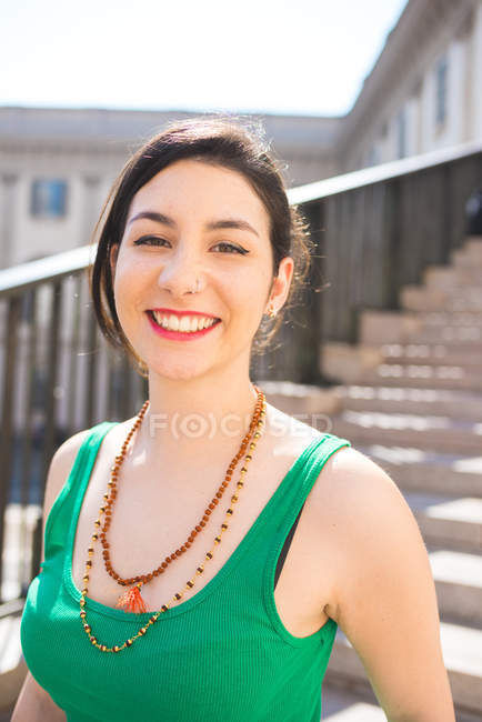 Portrait of young woman smiling to camera, Milan, Italy — Stock Photo