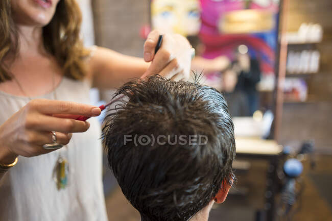 Hairstylist working in salon — Stock Photo
