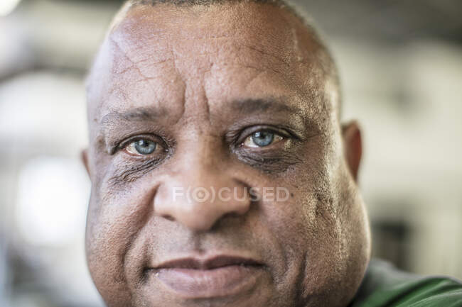 Head shot portrait of mature man looking at camera — Stock Photo