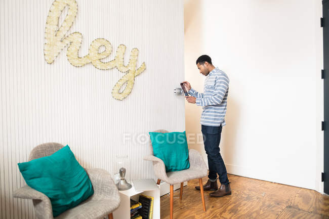Young man using digital tablet in creative office — Stock Photo