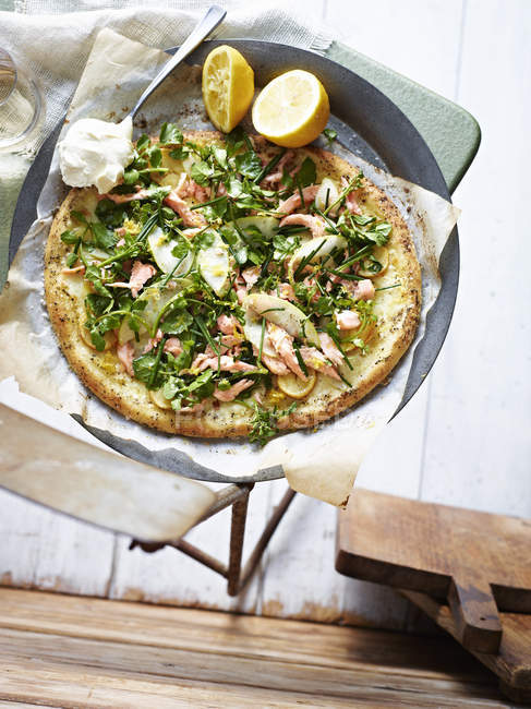 Smoked trout salad pizza , elevated view — Stock Photo