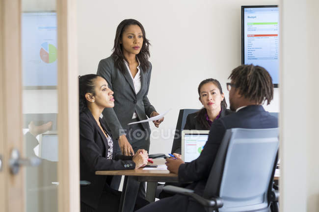Businessman and businesswomen working together in office — Stock Photo