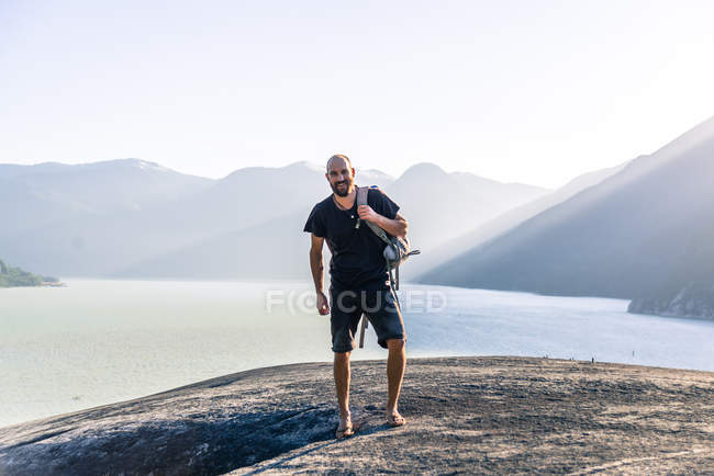 Portrait of young man hiker standing on mountain Malamute, Squamish, Canada — Stock Photo