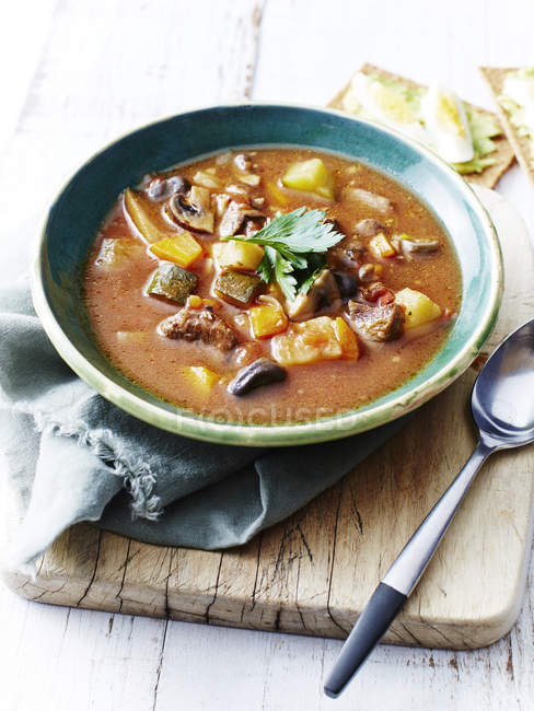 Spring lamb, vegetable soup on table — Stock Photo