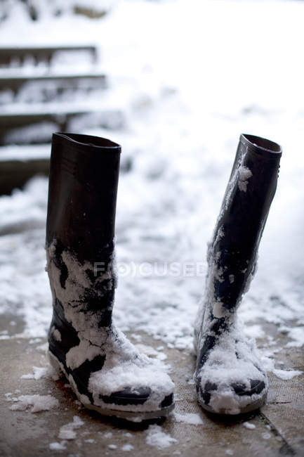 Close-up of pair of black boots in snow — Stock Photo