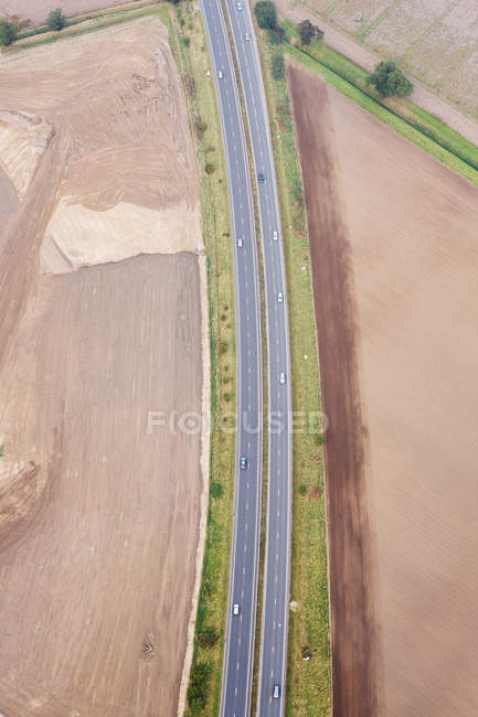 Aerial view of motorway with cars, UK — Stock Photo