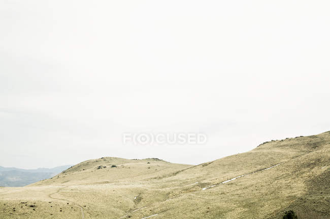 Green hills and grey cloudy sky, Nevada, USA — Stock Photo