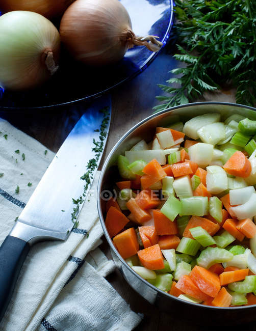 High angle view of freshly chopped vegetables in metal bowl — Stock Photo