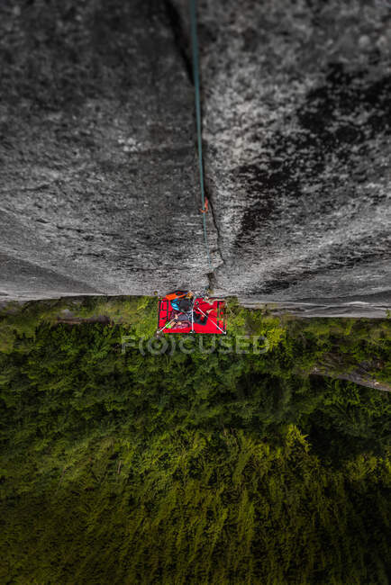 Woman on portaledge, Tantalus Wall, The Chief, Squamish, Canada, high angle view — стокове фото