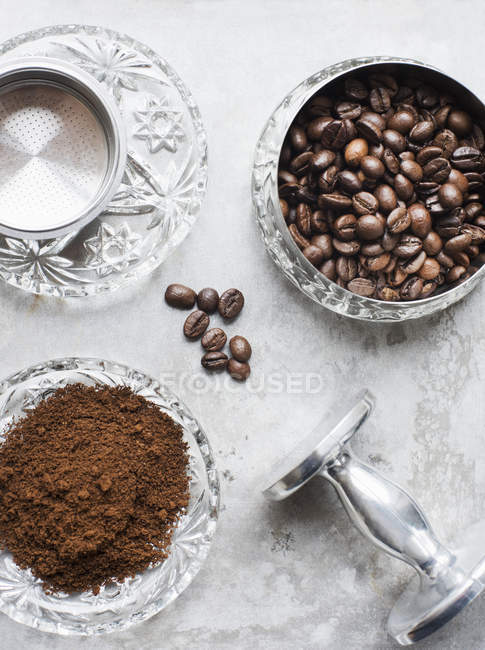 Overhead view of ground coffee and coffee beans — Stock Photo