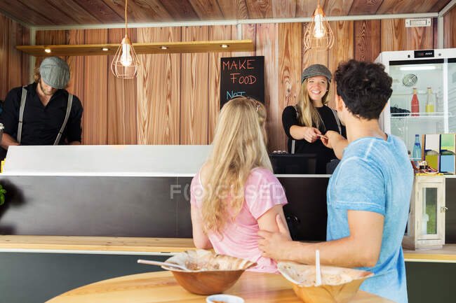 Customers paying at food truck — Stock Photo
