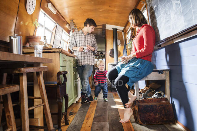 Family with baby boy living on barge — Stock Photo