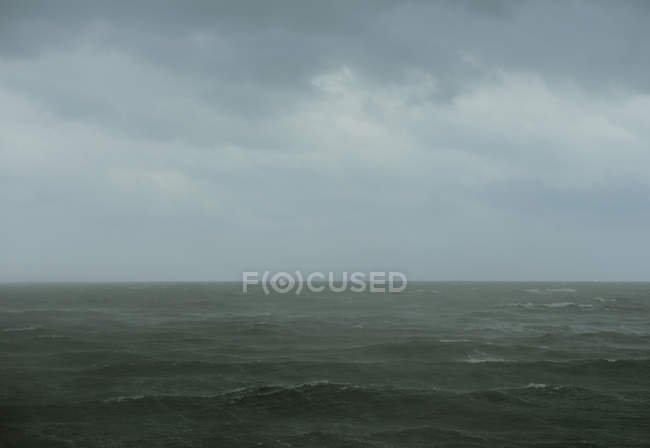 Scenic view of rain over sea, Scheveningen, South Holland, Netherlands, Europe — Stock Photo