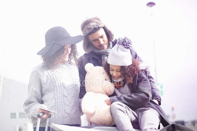 Front view of Parents with daughter and teddy bear — Stock Photo