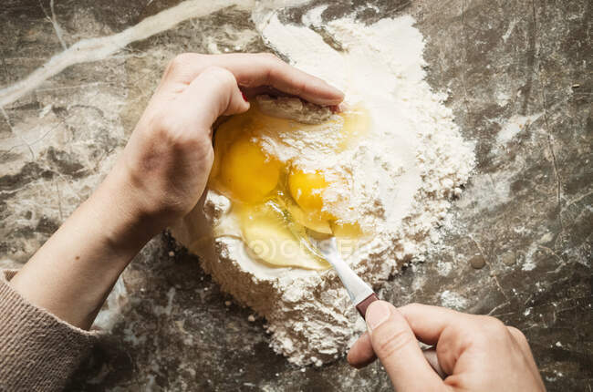 High angle close up of person preparing pasta tough. — стоковое фото