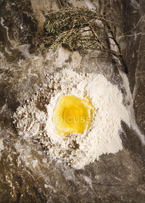 High angle close up of eggs and flour for pasta dough. — Stock Photo