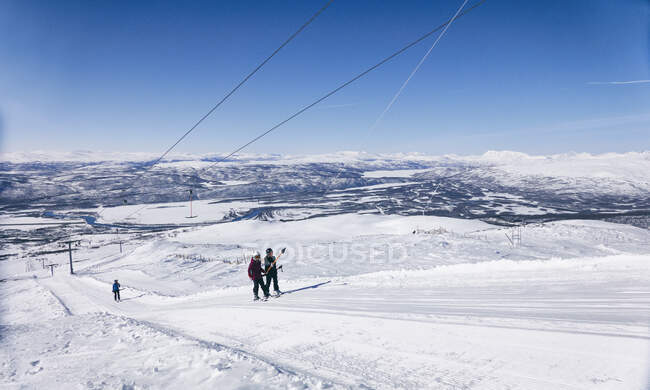 Skiers on a ski-lift in Vasterbottens Lan, Sweden. — Stock Photo
