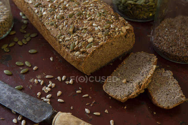 High angle close up of seeded loaf of bread. — Stock Photo
