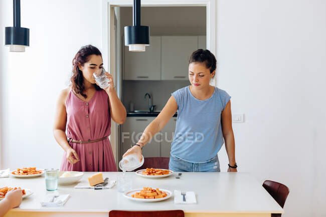 Friends enjoying lunch at home — Stock Photo