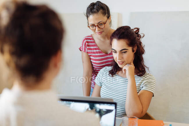 Colleagues working on project around table, close-up view — Stock Photo