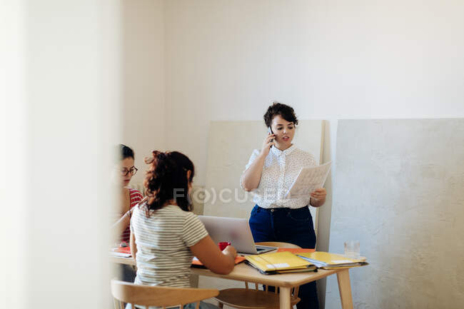 Colleagues working on project around table — Stock Photo