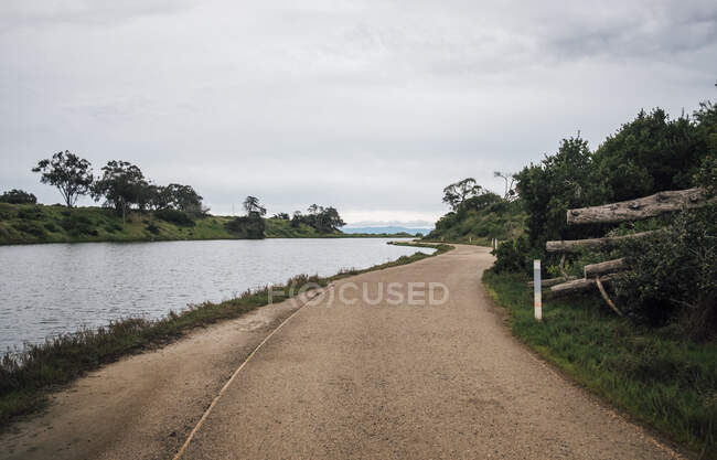 Rural road along a river near Santa Barbara, California, USA. — Stock Photo