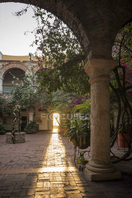 Convento de Santa Cruz de la Popa, historic convent building, courtyard with arches, cloisters and flowering shrubs — Stock Photo