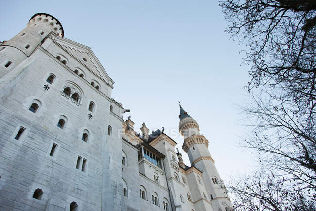 Low angle view of Neuschwanstein Castle with blue sky — Stock Photo