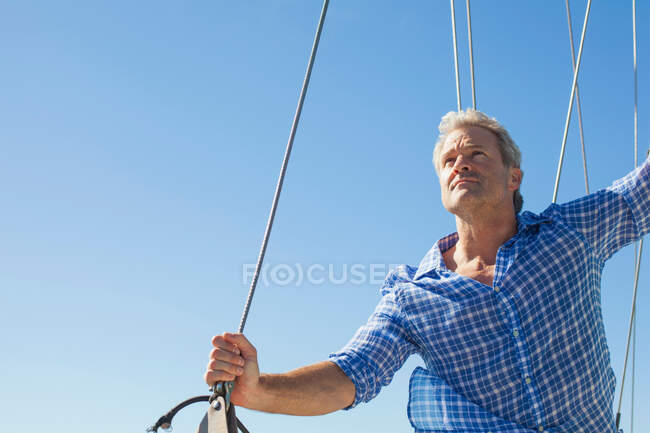 Man on yacht looking away — Stock Photo