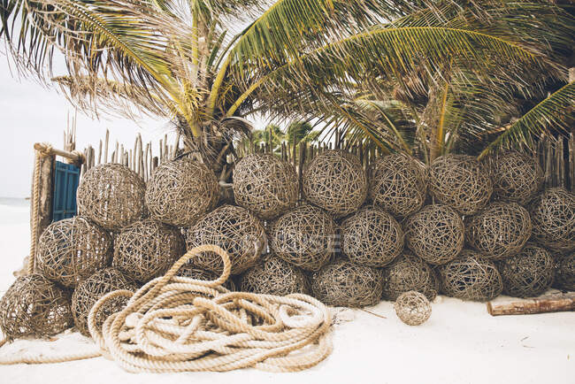 Woven baskets and rope on beach, Tulum, Mexico — Stock Photo