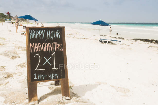 Bar Happy Hour sign on beach, Tulum, Mexico — Stock Photo