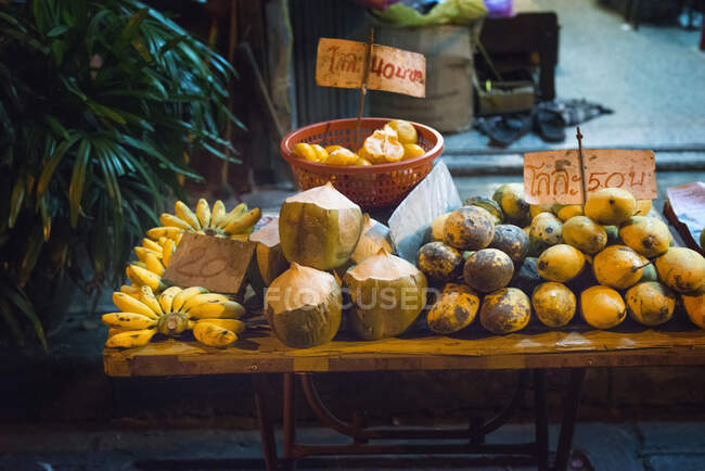 Coconuts for sale on market stall, Bangkok, Thailand — Stock Photo