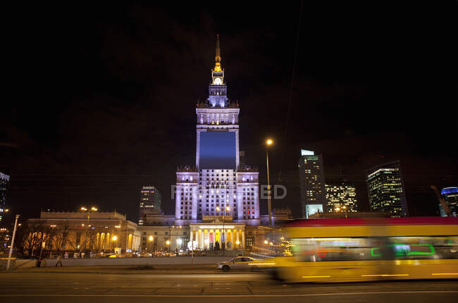 The Palace of Culture and Science illuminated at night, Warsaw, — Stock Photo